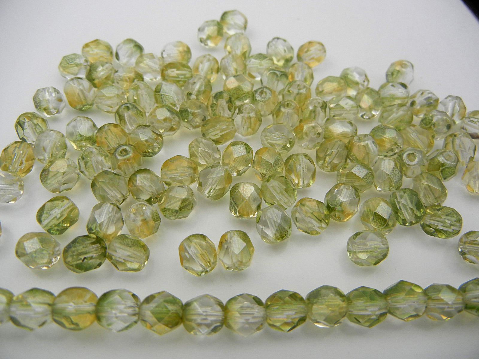 Crystal Yellow Luster coated, Czech Fire Polished Round Faceted